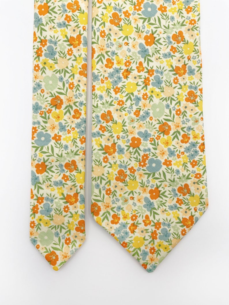 A handmade floral necktie with a small ditsy flower print.