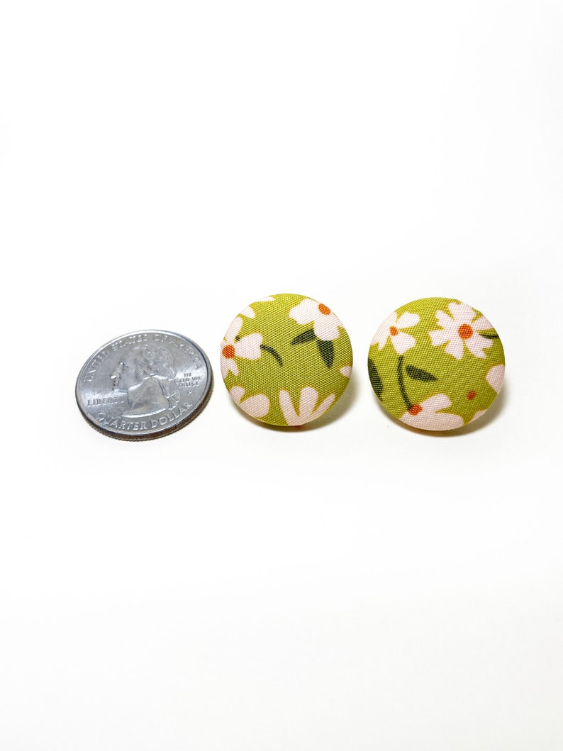 Handmade green floral fabric covered post earrings. The earrings are 0.875 inches, roughly the same size as a quarter.