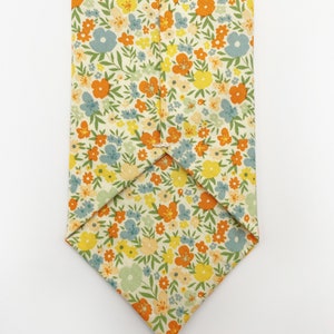 A handmade floral necktie with a small ditsy flower print.