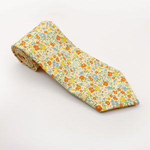 A handmade floral necktie with a small ditsy flower print.