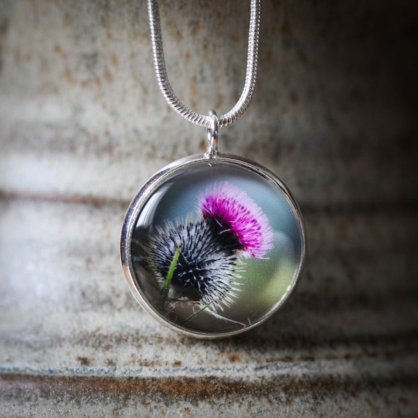 A hand crafted silver plated 20mm or 16mm pendant featuring an original photograph