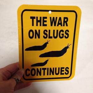 The war on slugs continues Funny Sign 6x8 inch Aluminum metal Garden Slug