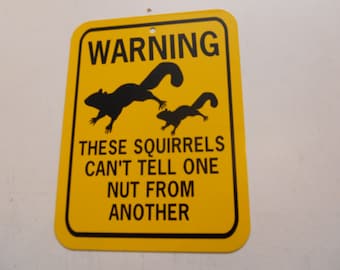 Warning these squirrels can't tell one nut from another  Funny Squirrel Sign 6x8 inch Aluminum metal garden sign