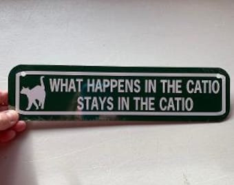 What happens in the catio  stays in the catio  Funny Cat Sign 3x12 inch Aluminum metal sign