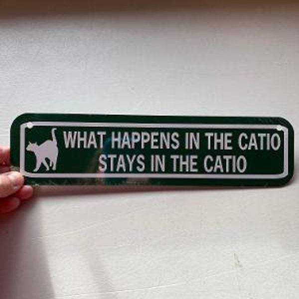 What happens in the catio  stays in the catio  Funny Cat house Sign 3x12 inch Aluminum metal sign