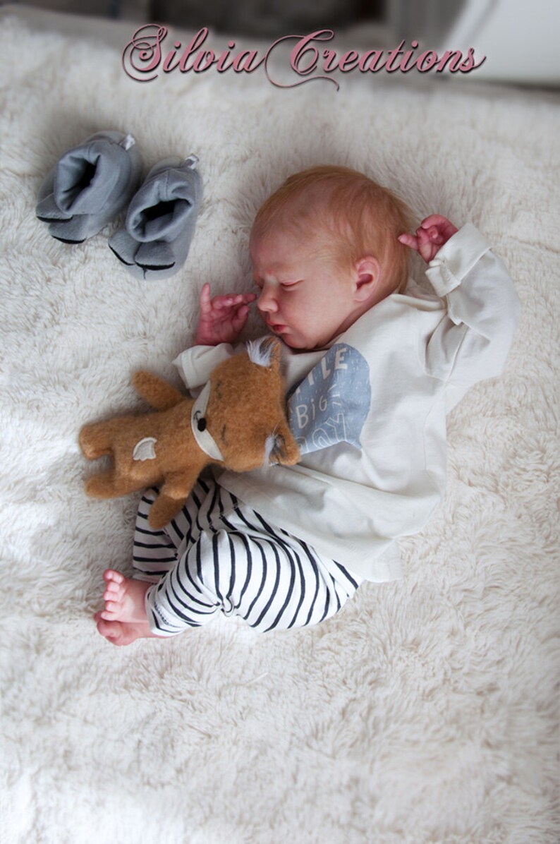 realborn logan sleeping