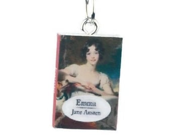 May include: A silver chain necklace with a pendant featuring a miniature book cover of "Emma" by Jane Austen. The cover depicts a woman in a white dress with a floral background.