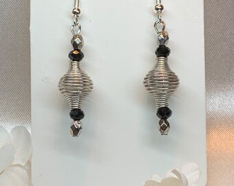 Spiral silver charms and black bicone beaded earrings handmade with care and style Stainless steel one of a kind