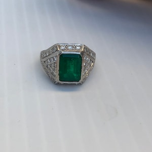 Vintage Emerald Cut Emerald and diamond ring in Platinum image 1