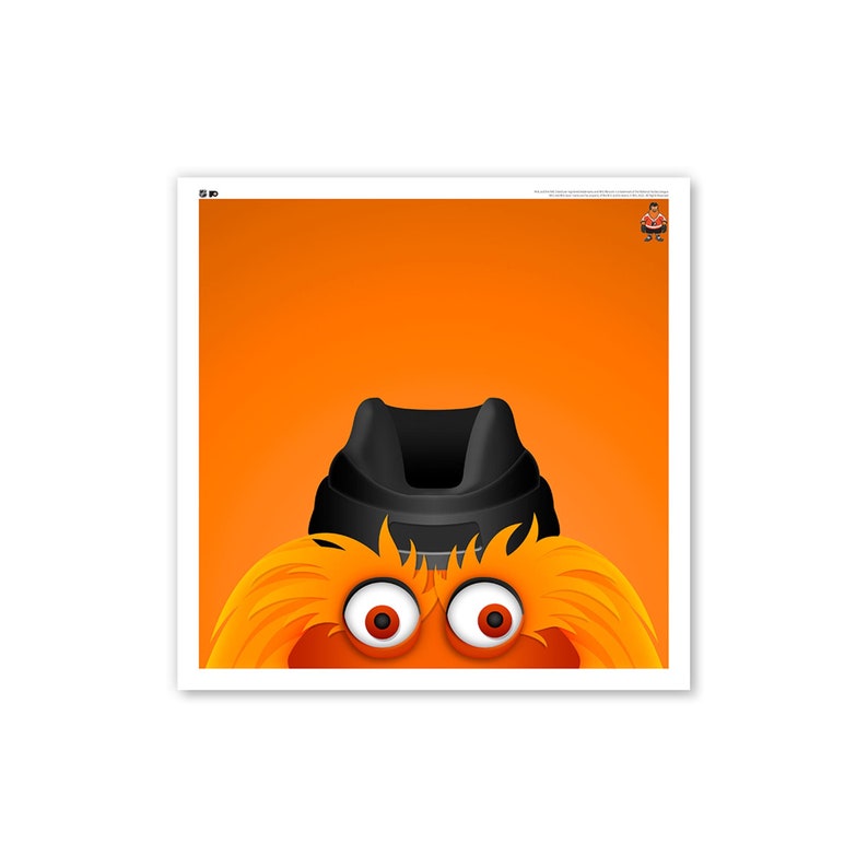 May include: A close-up of a fuzzy orange mascot with black eyes and a black hat. The mascot's eyes are wide open and staring directly at the viewer.