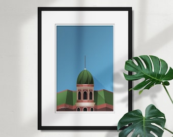 May include: Framed art print featuring a stylized illustration of a building with a green dome and red accents against a blue sky. The artwork is in a black frame with a white mat, suitable for home decor.