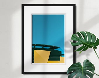 Könnte beinhalten: Gerahmter Kunstdruck mit einem abstrakten architektonischen Design. Das Kunstwerk zeigt eine lebendige Komposition mit einer leuchtend gelben geometrischen Form vor einem türkisblauen Hintergrund. Der Druck ist in einem schwarzen Rahmen mit weißem Passepartout eingefasst.