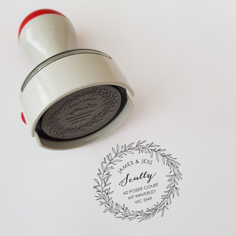 May include: A black and white return address stamp with a leafy wreath design. The text reads "JAMES & JESS Scully 40 POSER COURT MT WAVERLEY VIC 3149".