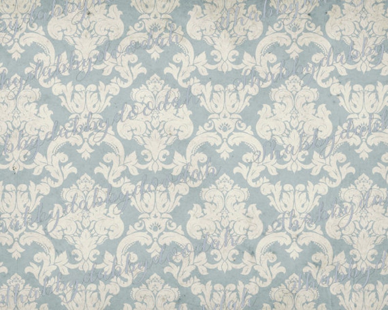 May include: A seamless pattern of a light blue background with a white damask design. The pattern is repeated throughout the image.