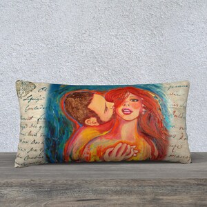 May include: A colorful painting of a couple embracing, with the woman's red hair flowing down her back. The painting is on a pillow with a vintage background.