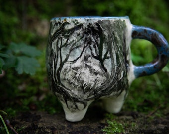 Unicorn in magic forest with hut, stag and spirits ceramic mug. Pottery