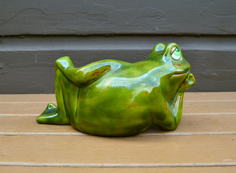 lounging frog statue