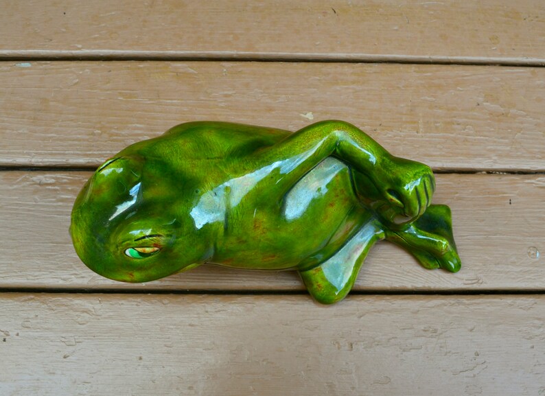 lounging frog statue