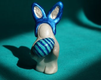 Miniature bunny with Easter egg sculpture, miniature decorated Easter egg, handmade Easter bunny with egg, stripes, blue, green, and white