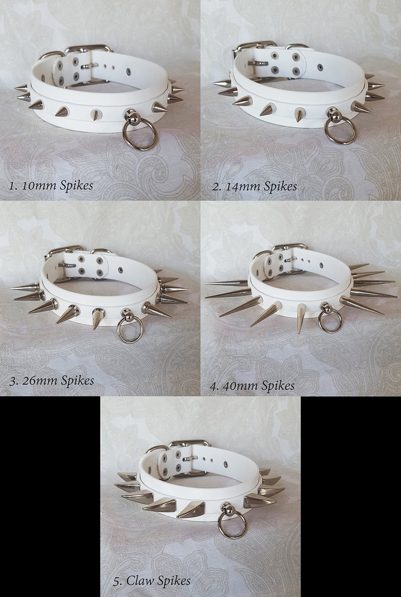 May include: Five white leather collars with different sized silver spikes. The collars have a silver ring attached. The collars are labeled 1. 10mm Spikes, 2. 14mm Spikes, 3. 26mm Spikes, 4. 40mm Spikes, and 5. Claw Spikes.