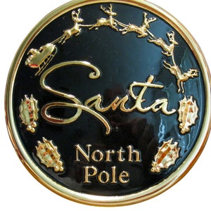 Gold 5 1/2" "Santa" Buckle With A Black Background