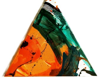 May include: Abstract triangular painting with orange, green, and black paint splatters and brushstrokes.