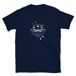 May include: Navy blue t-shirt with a white graphic of a dragonfly with a moon and stars design. The text "DRAGONFLY" is below the graphic.
