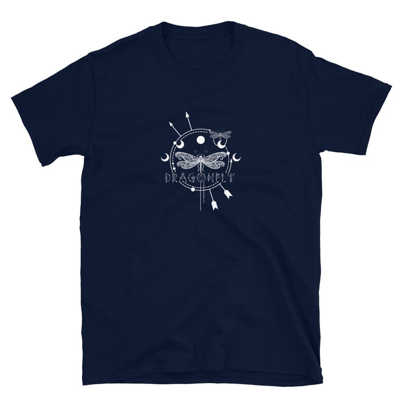 May include: Navy blue t-shirt with a white graphic of a dragonfly with a moon and stars design. The text "DRAGONFLY" is below the graphic.