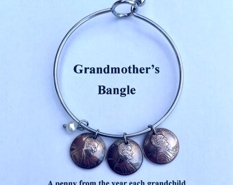 Grandmother’s Bangle Birth Year Pennies on a Stainless Steel Bangle Choose one or several with freshwater pearl