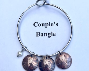 Couple’s Bangle Birth Year Pennies on a Stainless Steel Bangle Choose one or several with freshwater pearl