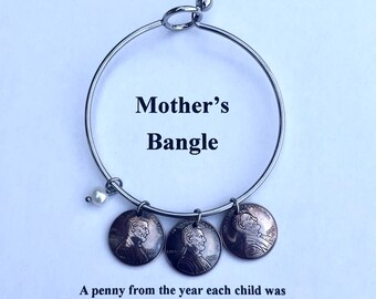 Mother’s Bangle Birth Year Pennies on a Stainless Steel Bangle Choose one or several with freshwater pearl