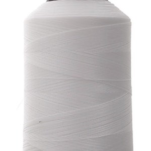 May include: A white spool of thread with a black plastic top and bottom.