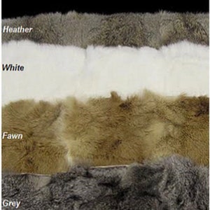 May include: Five different color swatches of rabbit fur. The colors are black, heather, white, fawn, and grey.