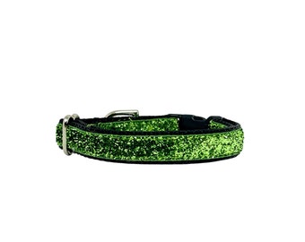 May include: A green glitter dog collar with a silver buckle and black nylon backing.