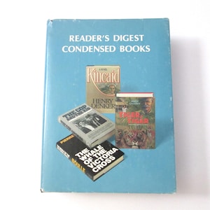 May include: A collection of Reader's Digest Condensed Books in a light blue cover. The books include titles like "Kincaid", "The Cop and the Kid", and "Tiger, Tiger". The book covers feature various illustrations and text.