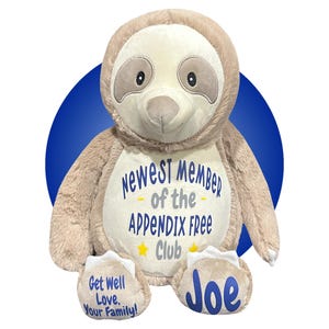 May include: A white ceramic mug with a black handle and the text "But First, Coffee" in a bold, black font. The mug is set against a neutral background, highlighting its simple design.