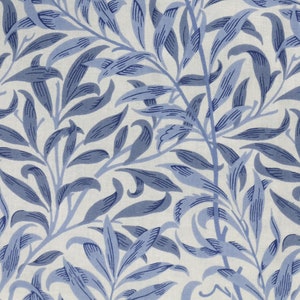 Cotton cushion cover with blue leaves and branches printed on a white background