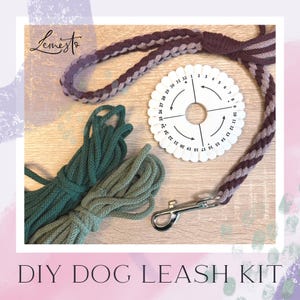 May include: A DIY dog lead kit featuring a braided lead in purple and grey, a white braiding disc, and two bundles of green rope. The kit includes a silver metal clasp. The text "DIY DOG LEASH KIT" is at the bottom.