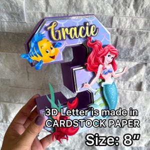 May include: A rustic wooden sign with the text "Welcome to our home" in white lettering. The sign features a distressed finish and a simple, inviting design, perfect for entryway decor.