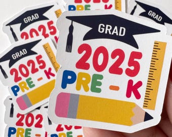 May include: A set of graduation stickers for pre-k students. The stickers are white with a black graduation cap, a yellow pencil, a ruler, and the text "GRAD 2025 PRE-K".
