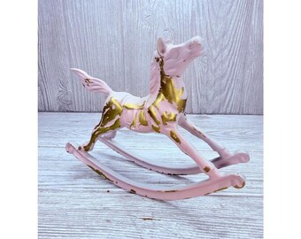 Vintage brass rocking horse decor / rustic color shifting painted pink / white