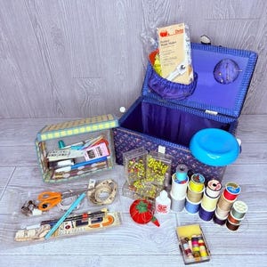 Vintage sewing box with all the supply’s , needles , thread , pin cushions , ect