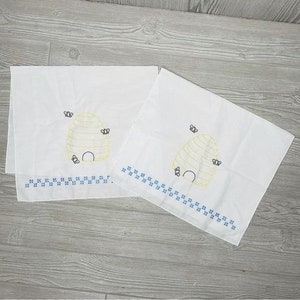 Two vintage cross stitch bee hive bee napkins / kitchen towels
