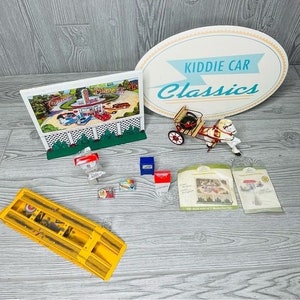 Vintage hallmark kiddie car movie , sign , trash can , news paper, mechanic ect