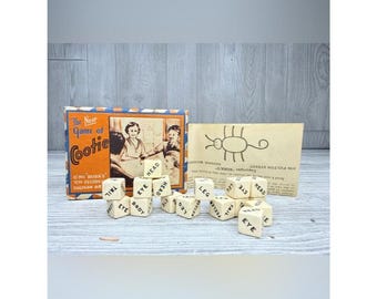 Juego de dados Cooties vintage, raro y difícil de encontrar, de la década de 1930, con caja, reglas y 16 dados.