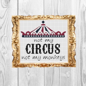 May include: A framed cross-stitch design with a red, white, and blue circus tent and the text "not my circus, not my monkeys".