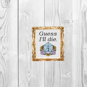 May include: A framed cross-stitch design featuring a blue and white dice with the number 1 on it. The dice is surrounded by flowers and the text "Guess I'll die."