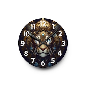 May include: A round wall clock with a detailed illustration of a tiger's face and crown. The clock face is dark blue with white numerals. The tiger's face is gold, with blue eyes and intricate details.