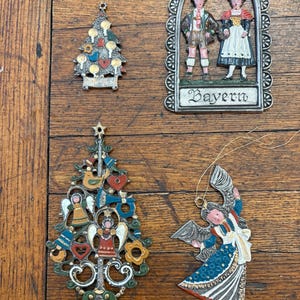 Lot of 4 vintage Kuhn Zinn pewter ornaments.