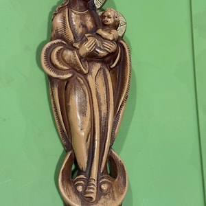 Vintage pair of religious plaster statues, featuring Jesus with a Sacred Heart and the Virgin Mary holding the infant Jesus.